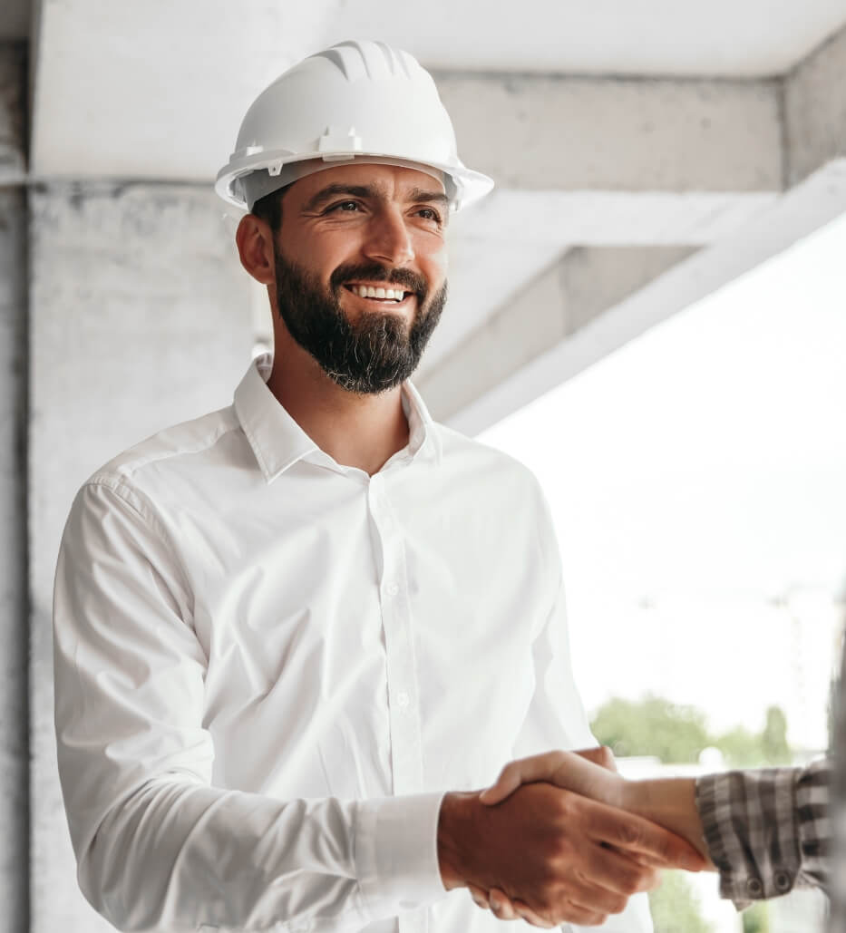 successful contractor shaking new client hand